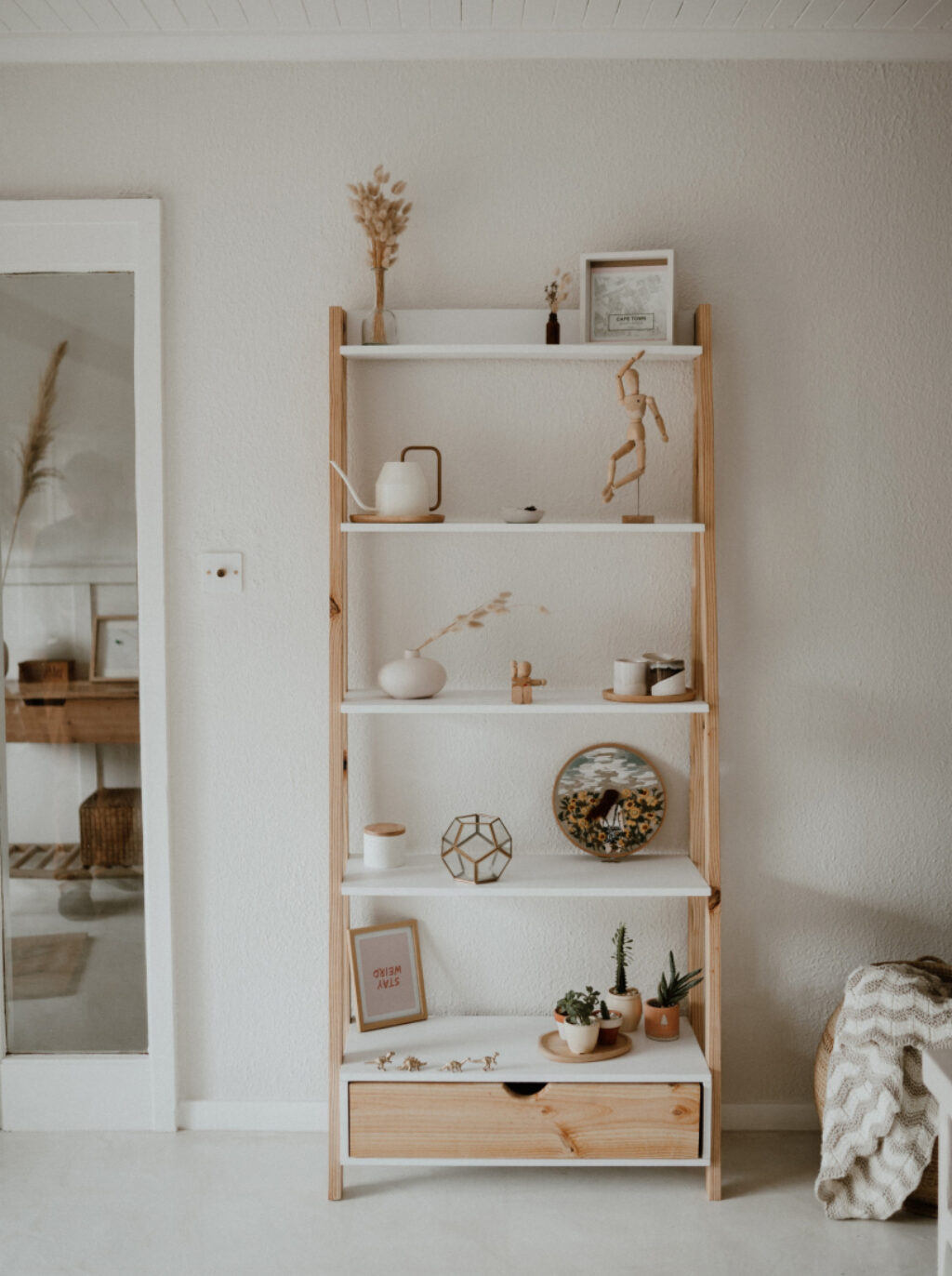 Shelves in living space with white wall